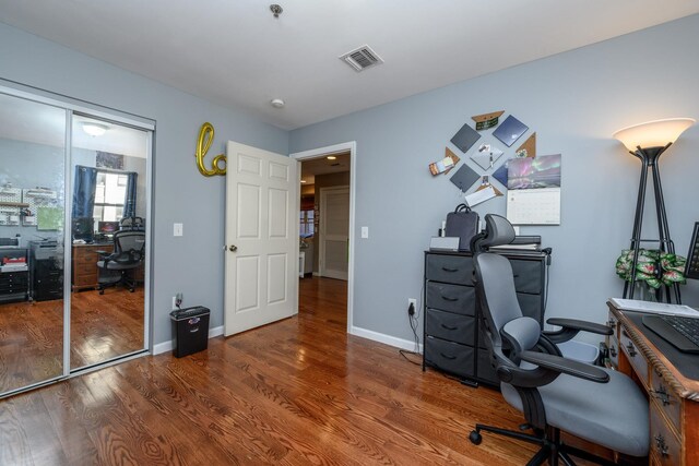 135 38th St Unit 407, Union City, NJ 07087 - home office featuring baseboards, visible vents, and wood finished floors