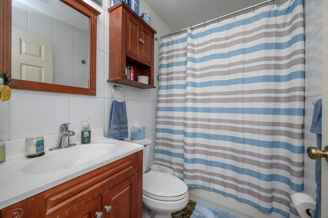 135 38th St Unit 407, Union City, NJ 07087 - full bathroom featuring tile walls, toilet, backsplash, and vanity