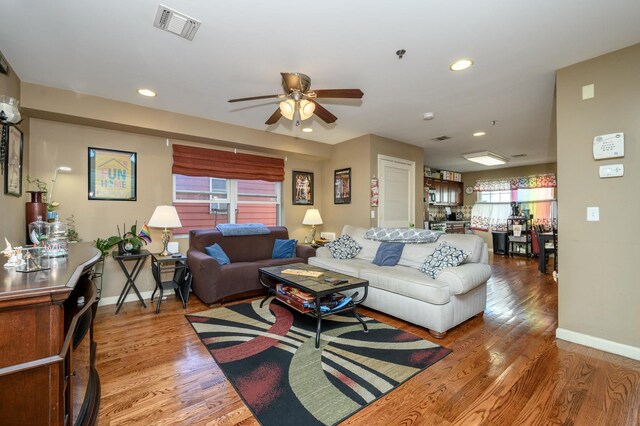 135 38th St Unit 407, Union City, NJ 07087 - living area with a ceiling fan, wood finished floors, baseboards, and visible vents