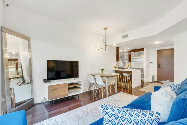 601 Observer Hwy Unit 204, Hoboken, NJ 07030 - living room featuring a chandelier and wood finished floors