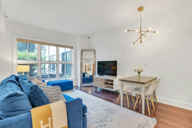 601 Observer Hwy Unit 204, Hoboken, NJ 07030 - living area with a chandelier, wood finished floors, and baseboards