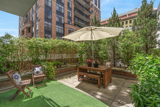601 Observer Hwy Unit 204, Hoboken, NJ 07030 - view of patio featuring outdoor dining area and fence