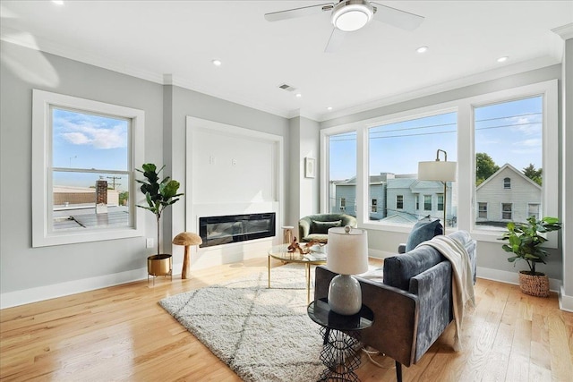 181 Bartholdi Ave Unit 2, Jersey City, NJ 07305 - living room with ornamental molding, healthy amount of natural light, light wood finished floors, baseboards, and recessed lighting