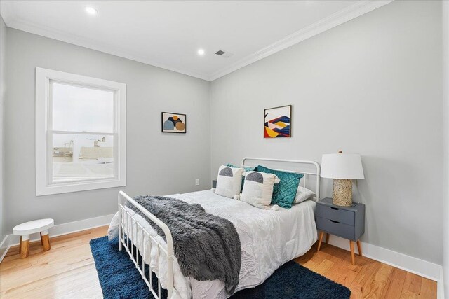 181 Bartholdi Ave Unit 2, Jersey City, NJ 07305 - bedroom with ornamental molding, wood finished floors, baseboards, and recessed lighting