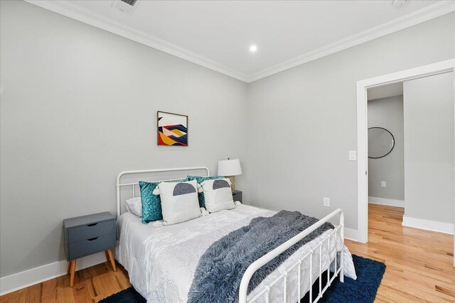 181 Bartholdi Ave Unit 2, Jersey City, NJ 07305 - bedroom featuring ornamental molding, wood finished floors, baseboards, and recessed lighting