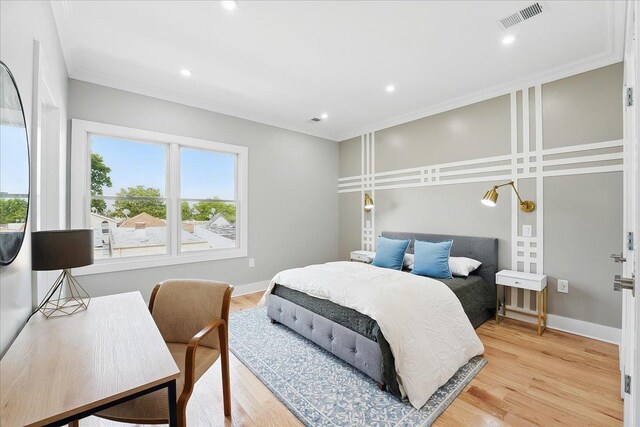 181 Bartholdi Ave Unit 2, Jersey City, NJ 07305 - bedroom with crown molding, light wood-style flooring, recessed lighting, and baseboards
