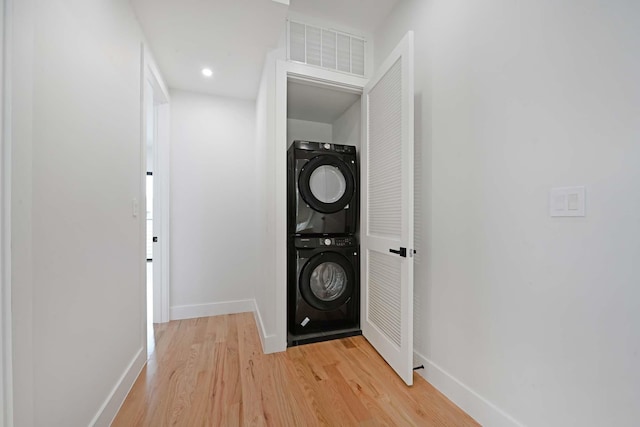 262 Webster Ave Unit 2, Jersey City, NJ 07307 - laundry area featuring stacked washer / dryer, light wood-type flooring, and recessed lighting