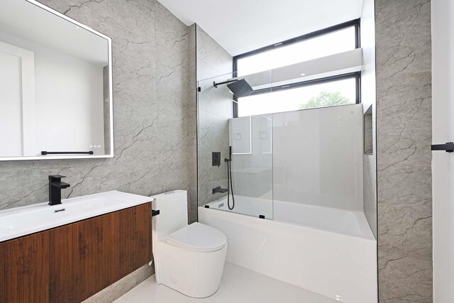 262 Webster Ave Unit 2, Jersey City, NJ 07307 - bathroom featuring vanity, shower / washtub combination, and tile walls