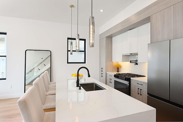 262 Webster Ave Unit 2, Jersey City, NJ 07307 - kitchen featuring freestanding refrigerator, gas range oven, modern cabinets, light wood-type flooring, and recessed lighting