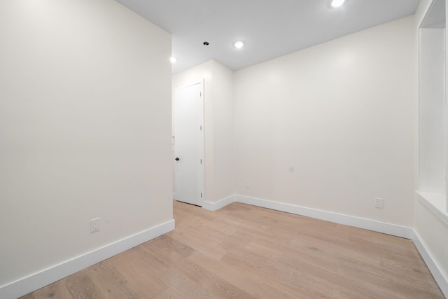 spare room with light hardwood / wood-style floors