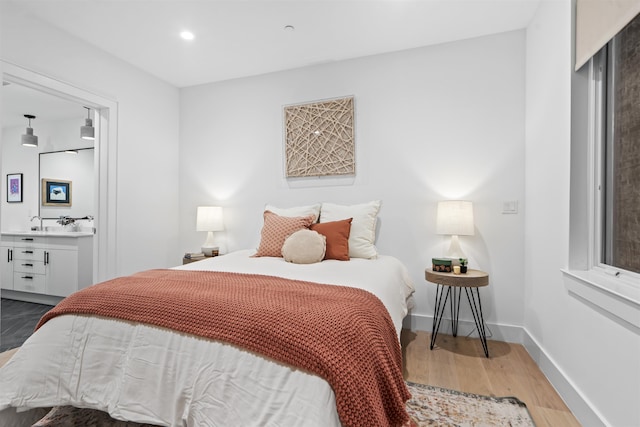 371 2nd St Unit 2B, Jersey City, NJ 07302 - bedroom featuring wood finished floors, ensuite bathroom, recessed lighting, and bar