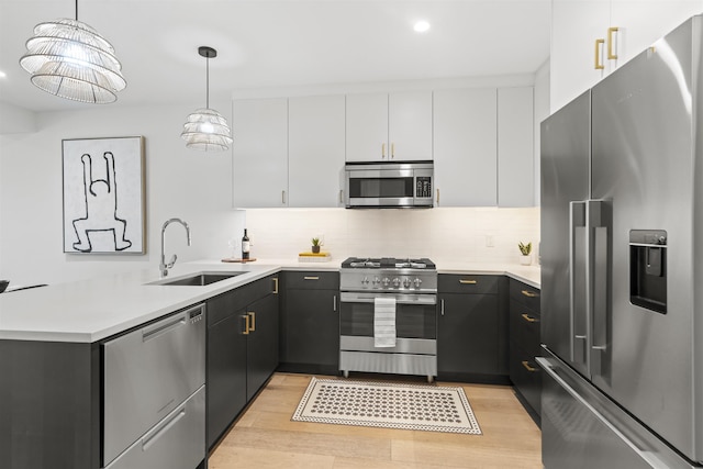 371 2nd St Unit 2B, Jersey City, NJ 07302 - kitchen with appliances with stainless steel finishes, a peninsula, light countertops, and recessed lighting