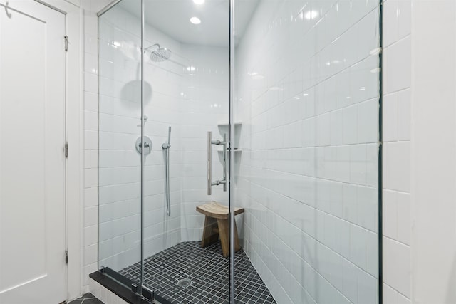371 2nd St Unit 2B, Jersey City, NJ 07302 - bathroom featuring tile walls, a stall shower, and tile patterned flooring