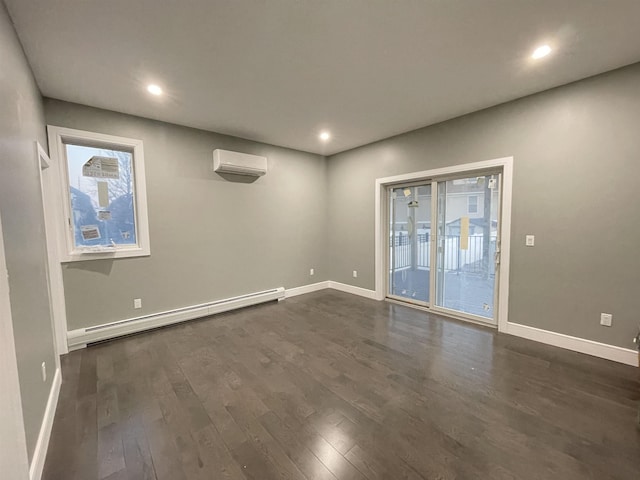 29 Carlton Ave Unit 2, Jersey City, NJ 07307 - spare room featuring a baseboard radiator, a wall mounted AC, dark wood-style flooring, and recessed lighting