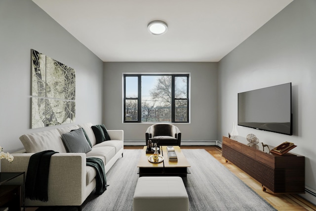 living room with baseboard heating and light wood-type flooring