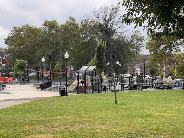 view of community with a playground and a lawn