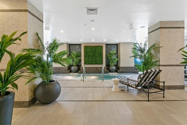 building lobby featuring visible vents