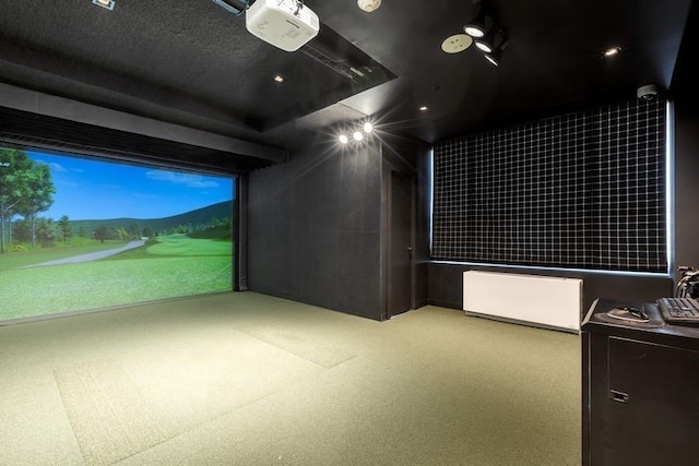 home theater room with carpet and golf simulator