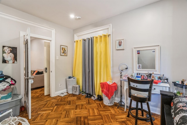 office area with dark parquet floors