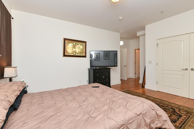 bedroom with wood finished floors