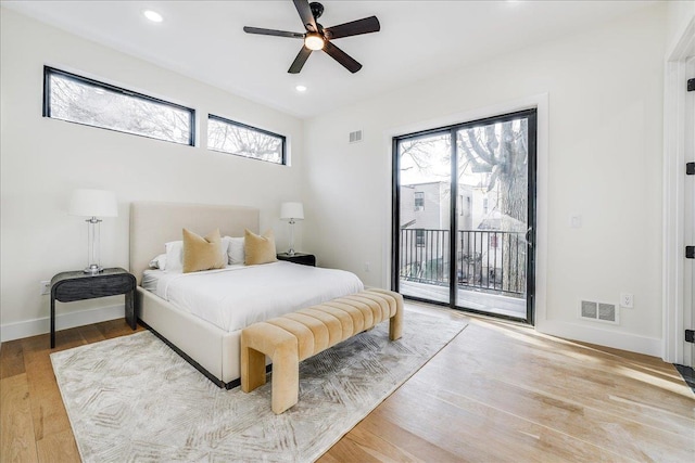 bedroom featuring wood finished floors, visible vents, baseboards, recessed lighting, and access to exterior