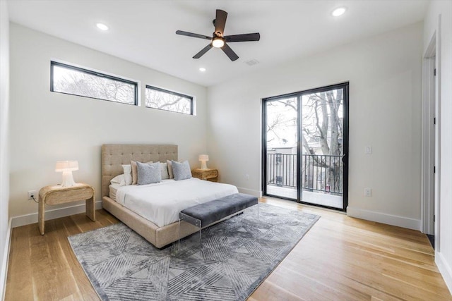 bedroom featuring access to outside, recessed lighting, light wood-style flooring, and baseboards