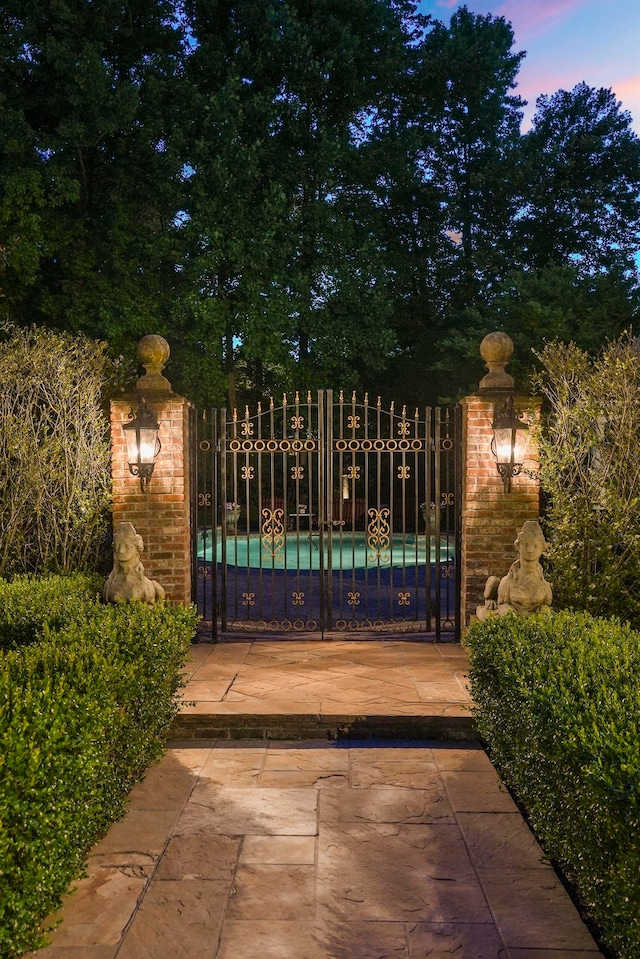 view of gate at dusk