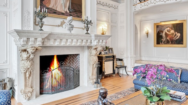 living room featuring ornamental molding and hardwood / wood-style flooring