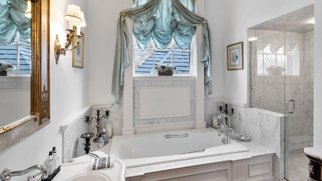 bathroom featuring plenty of natural light, sink, and independent shower and bath