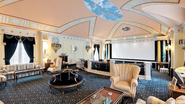 carpeted cinema featuring high vaulted ceiling