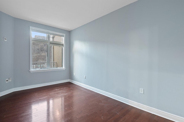 empty room with dark wood-type flooring