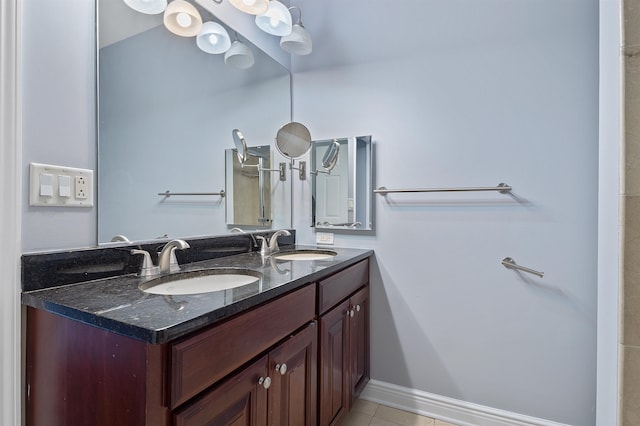 bathroom with tile patterned flooring and vanity