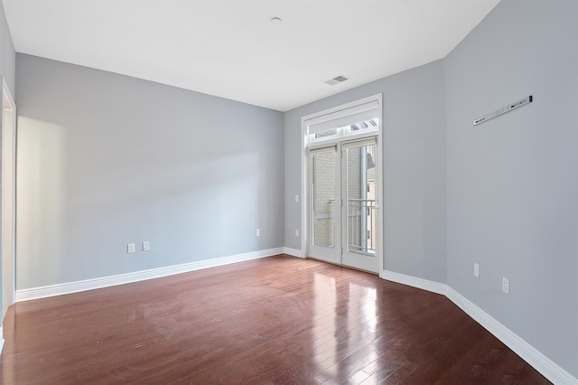 empty room featuring hardwood / wood-style flooring