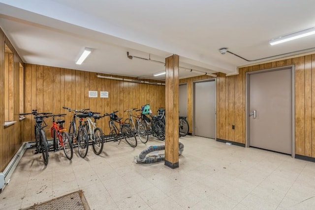 interior space featuring wooden walls and light floors