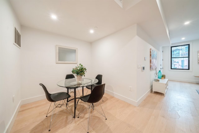 dining space featuring light hardwood / wood-style floors