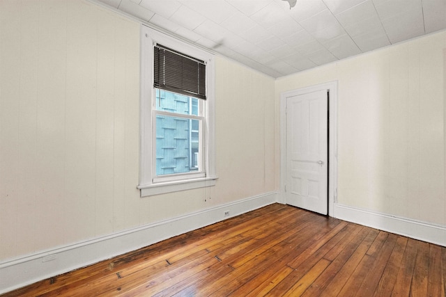 spare room featuring hardwood / wood-style flooring