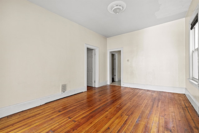 empty room with wood-type flooring