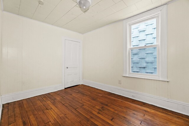 spare room with hardwood / wood-style flooring