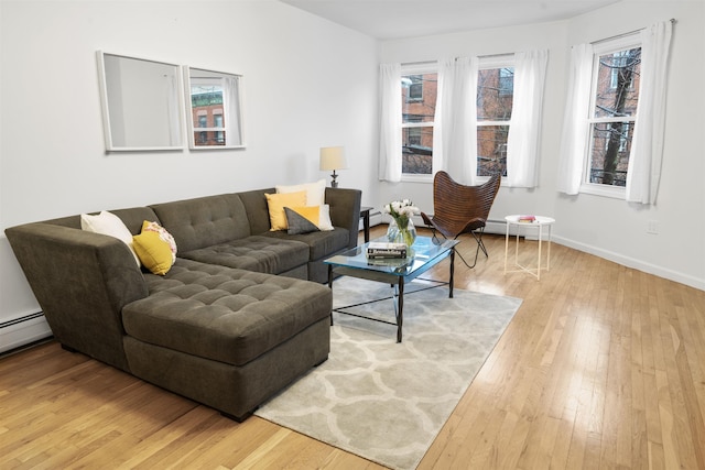 living room with baseboards and hardwood / wood-style flooring