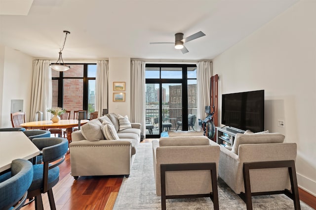84 Willow Ave Unit 4B, Hoboken, NJ 07030 - living room featuring dark wood-style floors, healthy amount of natural light, and a ceiling fan