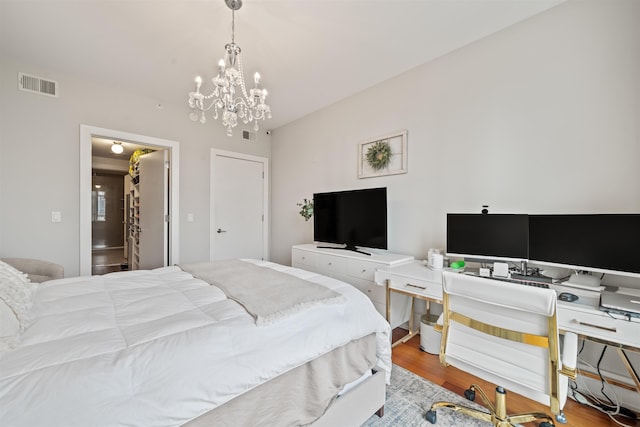 84 Willow Ave Unit 4B, Hoboken, NJ 07030 - bedroom with wood finished floors and a chandelier