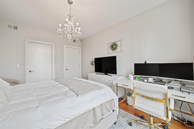 84 Willow Ave Unit 4B, Hoboken, NJ 07030 - bedroom featuring a chandelier and wood finished floors