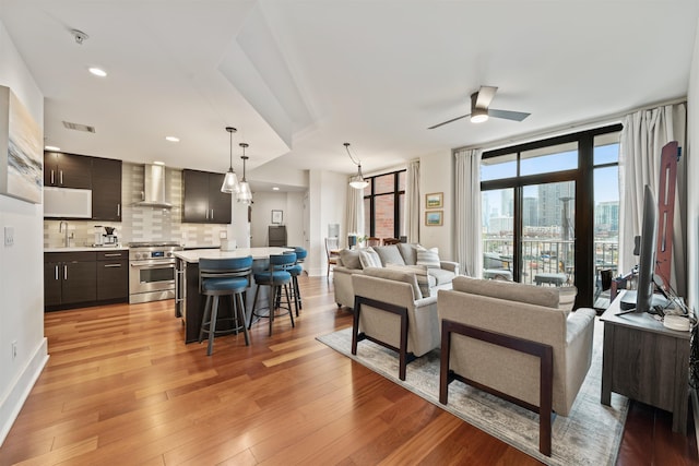 84 Willow Ave Unit 4B, Hoboken, NJ 07030 - living area with ceiling fan, light wood-style floors, and recessed lighting