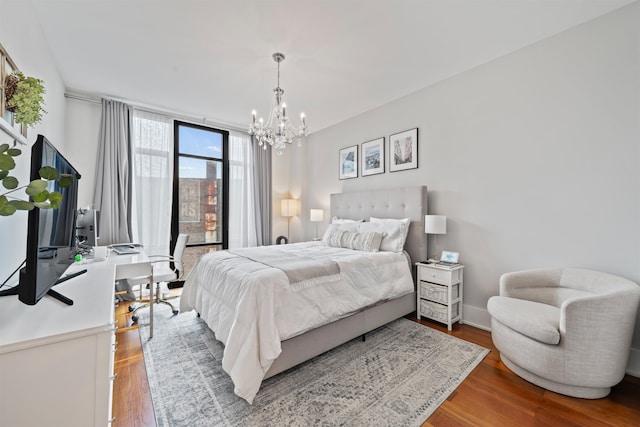 84 Willow Ave Unit 4B, Hoboken, NJ 07030 - bedroom with a chandelier and wood finished floors