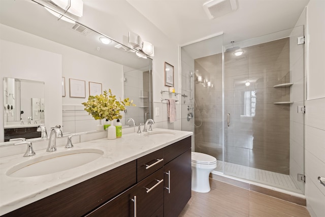 84 Willow Ave Unit 4B, Hoboken, NJ 07030 - bathroom with double vanity, a stall shower, and tile patterned flooring
