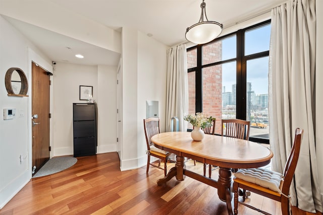 84 Willow Ave Unit 4B, Hoboken, NJ 07030 - dining space featuring light wood-type flooring and a city view