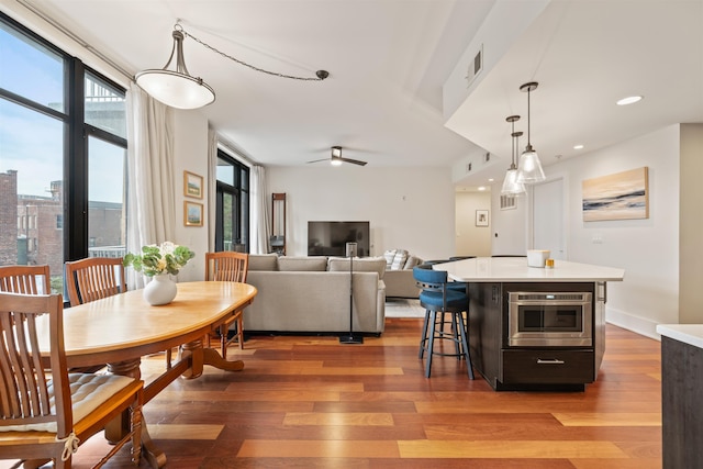 84 Willow Ave Unit 4B, Hoboken, NJ 07030 - dining room with light wood-style floors, healthy amount of natural light, a ceiling fan, and recessed lighting