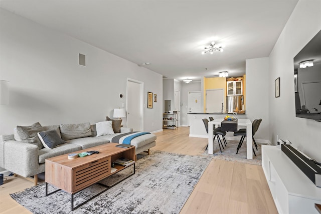24 Ave At Port Imperial Unit 305, West New York, NJ 07093 - living area with baseboards, light wood-style floors, and visible vents