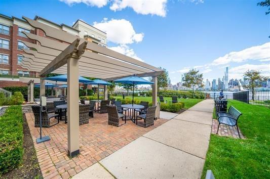 24 Ave At Port Imperial Unit 305, West New York, NJ 07093 - view of property's community with a pergola, a patio, and fence