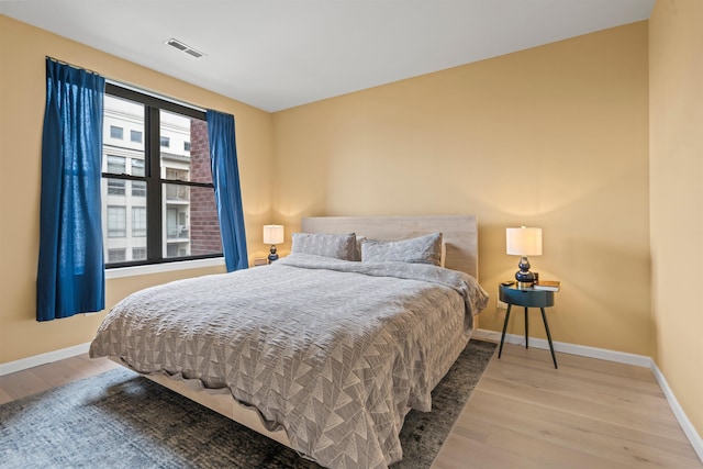 24 Ave At Port Imperial Unit 305, West New York, NJ 07093 - bedroom with wood finished floors, visible vents, and baseboards